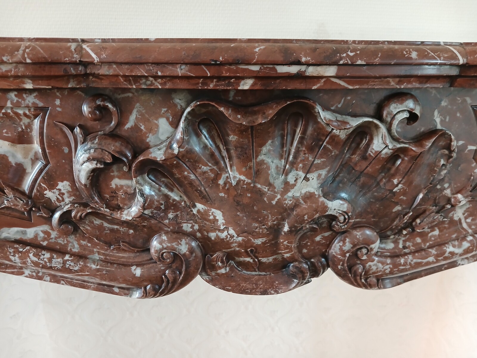 Large Louis XV fireplace made out of a striking-red marble