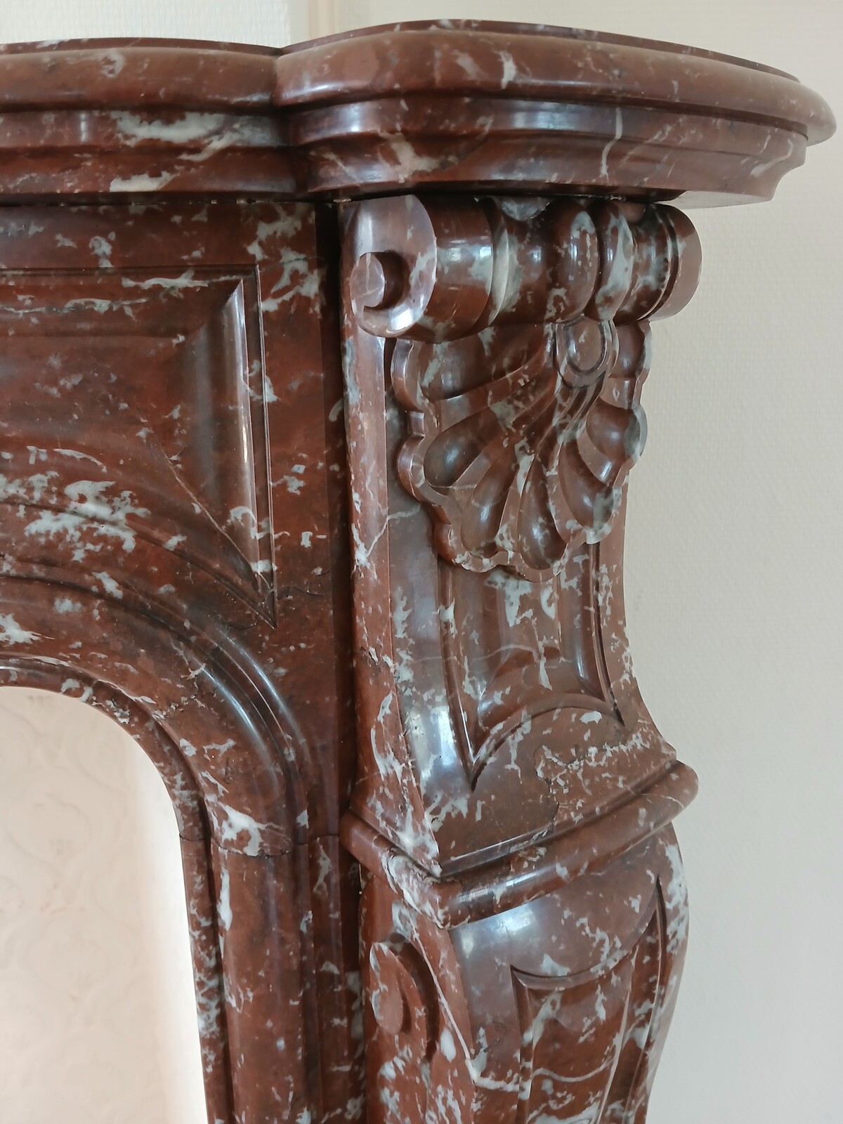 Large Louis XV fireplace made out of a striking-red marble