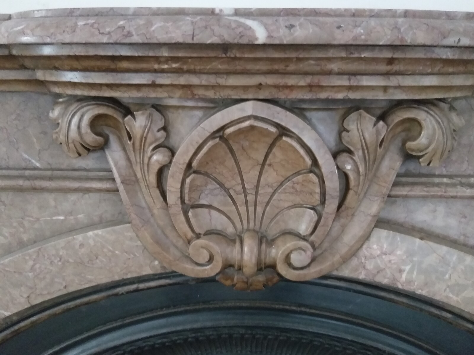 Victorian style fireplace in Napoléon Grande Mélange marble